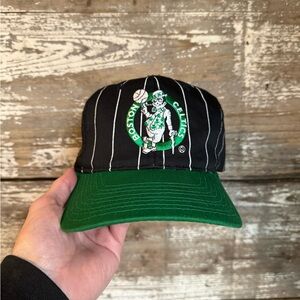 Vintage starter pin stripe Boston Celtics black and green snapback hat.